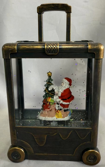 黒いブラシゴールドスーツケースランプサンタクロースと木のインテリアの飾り