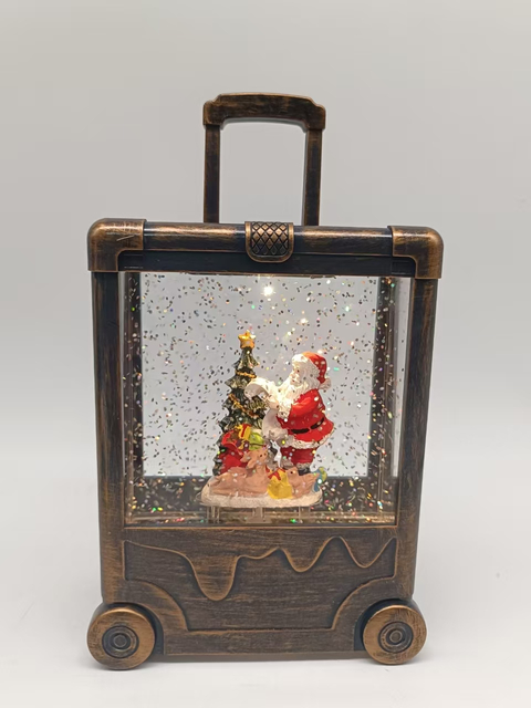 黒いブラシゴールドスーツケースランプサンタクロースと木のインテリアの飾り